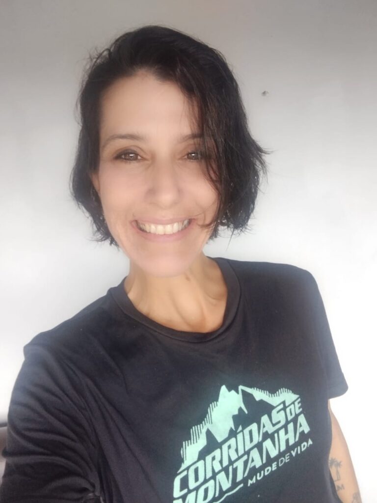 Foto de perfil de um organizador da SP Endurance Challenge, sorrindo, refletindo a energia e dedicação ao evento.